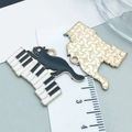 Piano black cat alloy enamel pendant with musical keys and golden metallic textured back - Black Cat On Piano (18557)