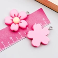 Detail view of pink resin flower charms with measurements and metal rings for DIY jewelry - Rose Red Five-Petal Flower (24340) / 27*25*6mm