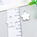 White flower-shaped zinc alloy charm with silver center for DIY jewelry making - Flower (23523) / 1 Piece/Pack (17x14x2mm) / White