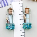 Pendentif mini bouteille en verre avec paillettes bleues, coquillage naturel et bouchon - Bleu sarcelle
