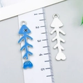 Blue enamel fishbone alloy pendant for DIY jewelry making shown with measuring scale - Fishbone (23525) / 1 Piece Pack (35x11x1mm) / Lake Blue