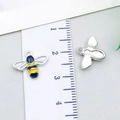 Yellow and black enamel bee charm in alloy metal with ruler showing 2.5cm width - Bee (23968) / 1 Piece Pack (12x14x3mm) / Yellow