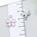 Pink enamel flower charms with faux pearls and silver pendants beside a measurement ruler - Beaded Cherry Blossom (24201) / 1 Piece Pack (15x12x4mm) / Pink