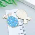 Blue enamel bunny egg charm with colorful dots and light gold metal back for DIY crafts - Cyan Spotted Rabbit Egg (25135)