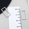 Polished silver stainless steel rectangular connector buckles shown with size ruler - Rectangle Style