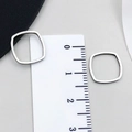 Silver square hollow stainless steel charm measured with calipers showing 1.2cm size - Rounded Square Style
