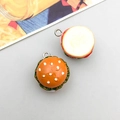 Macro shot of two realistic 3D hamburger pendants with silver metal hooks for DIY jewelry - Light Coffee Small Burger (17080)