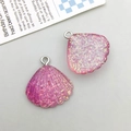 Detailed view of pink glitter resin shell charms with silver metal rings for DIY jewelry - Purple Gradient
