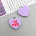 Detailed view of lavender heart-shaped resin pendants with Be Mine engraving and silver rings - Purple Alphabet Heart (16423)