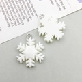 Detailed view of white snowflake resin charms with silver rings for DIY jewelry making - White Resin Christmas Snowflake (17026)