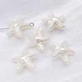 Cinq breloques en forme d'étoile de mer en perles ABS blanc crème pour bijoux DIY - Forme d'Étoile de Mer (25805)