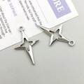 Detailed close-up of hollow silver star charms for DIY jewelry making accessories - 15*25mm / Antique Silver