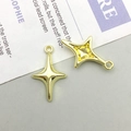 Detail of two hollow gold four-point star alloy pendants for DIY jewelry making - 12*19mm / KC Gold