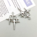 Macro detail of silver four-pointed star link pendant for DIY jewelry making - 23*29mm / Silver