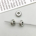 Macro shot of antique silver alloy spacer beads with radial texture for DIY jewelry - Antique Silver Round Spacer Bead (16329)