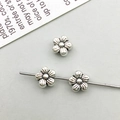 Macro view of three vintage silver flower alloy spacer beads for DIY jewelry design - Antique Silver Flower Spacer Bead (16330)