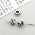Macro shot of vintage silver alloy large hole spacer beads with rope texture for DIY jewelry - Antique Silver Round Spacer Bead (16343)