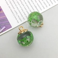 Detailed macro view of globe glass pendants with natural dried green flowers inside - Green Gypsophila Glass Ball (16405) / 1 Piece (16x20mm) / Grass Green