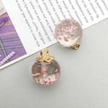 Detailed view of a round glass ball pendant with pink dried flowers and gold metal cap - Pink Gypsophila Glass Ball (16406) / 1 Piece (16x20mm) / Pink