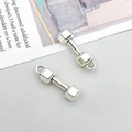 Detailed view of antique silver dumbbell charms for DIY jewelry making and necklaces - Dumbbell (Antique Silver) 6x20mm (9008)