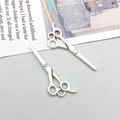 Detailed view of silver antique alloy hair stylist scissor charms for DIY jewelry making - Barber Scissors Style