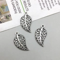 Detailed view of three vintage silver hollow leaf pendants for DIY jewelry making - Antique Silver (3962)
