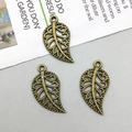 Detailed view of vintage bronze hollow leaf charms for DIY jewelry making and crafts - Antique Bronze (3985)