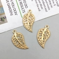 Detailed close-up of hollow golden leaf charms with intricate veins for DIY jewelry - Light Gold (10096)