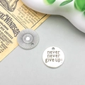 Macro shot of silver alloy round pendant engraved with Never Never Give Up and sunburst motif - Letter never never give up (2492) / 19*19mm