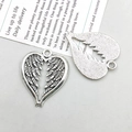 Detailed front and back view of silver heart wing pendant with vintage texture - Antique Silver Heart Wing (10397)