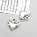 Macro view of vintage silver heart pendants with intricate filigree patterns for DIY jewelry - Antique Silver Heart (11204)