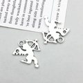 Detail shot of antique silver cupid charms with bow and wings for DIY jewelry making - Antique Silver Angel (11432)