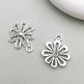 Detailed front and back view of silver hollow flower pendant for jewelry making - Antique Silver Flower Style (10403)
