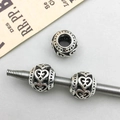 Macro shot of antique silver hollow heart charms for DIY jewelry making sets - Antique Silver Hollow Heart Style (16633) / 1 Piece/Pack (9x11mm)