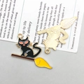 Front and back detail of Halloween black cat on broom enamel charms for DIY jewelry - Black Flying Broom Red Eye Cat (15137)