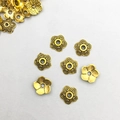 Detailed macro view of golden alloy flower bead caps with spiral textured petals for DIY - 8*8mm Antique Gold Flower Bead Cap (16602) - 1 Piece