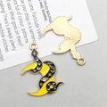 Macro detail of double-sided enamel moon and star charms for DIY jewelry making - Black Enamel Moon Snake (18169)