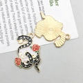Detailed view of skull snake and rose alloy pendant with enamel and star moon patterns - Black Enamel Skull Snake (18170)