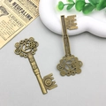 Set of two antique bronze alloy steampunk key pendants with intricate gear design details - Gear Key (8754) / 30x70mm