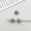 Three vintage hollow silver alloy spacer beads with intricate floral patterns for DIY jewelry - Antique Silver Round Spacer Bead (16339)
