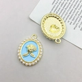 Detailed view showing both sides of a blue enamel rose pendant with pearl edge - KC Gold Blue Base Rose (15899)
