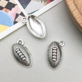 Detailed macro view of antique silver football helmet charms with realistic grain texture - American Football Style (9200)