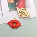 Macro shot of red enamel lip charms with gold metal finish and integrated hanging loop - Red Lip Design / 18x13mm