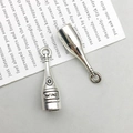 Macro detail of antique silver wine bottle pendants with clear WINE text engraving - Antique Silver Wine Bottle (10557)