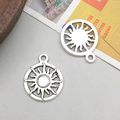 Macro shot of two vintage silver sun pendants with flame rays for DIY jewelry making - Moon Sun Style (8230)