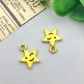 Detail of golden wink star charms with black engraved faces for DIY jewelry making - Antique Gold Star