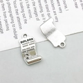 Macro detail of silver diploma charm showing engraved text and textured back for DIY jewelry - Antique Silver Diploma Style (3740)