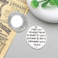 Close-up of vintage silver alloy charms featuring engraved quotes and sunburst patterns - May You Style (10897)