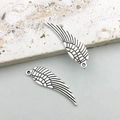 Macro detail of antique silver alloy angel wing charms with intricate feather textures - Small Wing Style (5009)