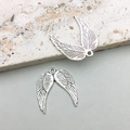 Detailed view of antique silver alloy angel wing charms with intricate feather textures - Heart Wing Style (10053)